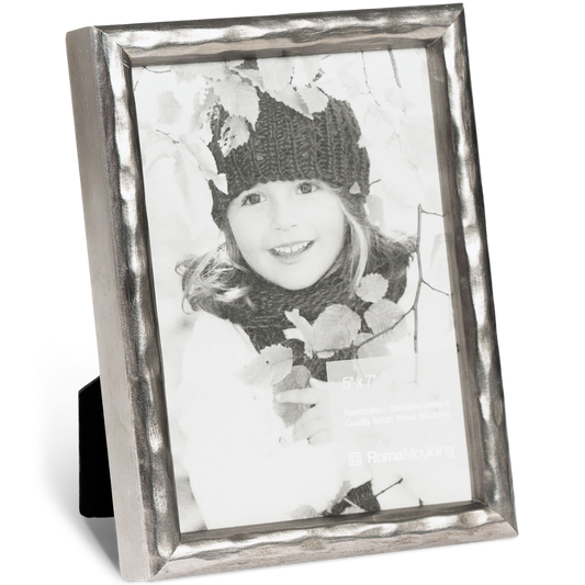 Black and white photo of a smiling child in a knitted hat and scarf, framed in a textured silver frame, expressing warmth and joy, size 5x7 inches.