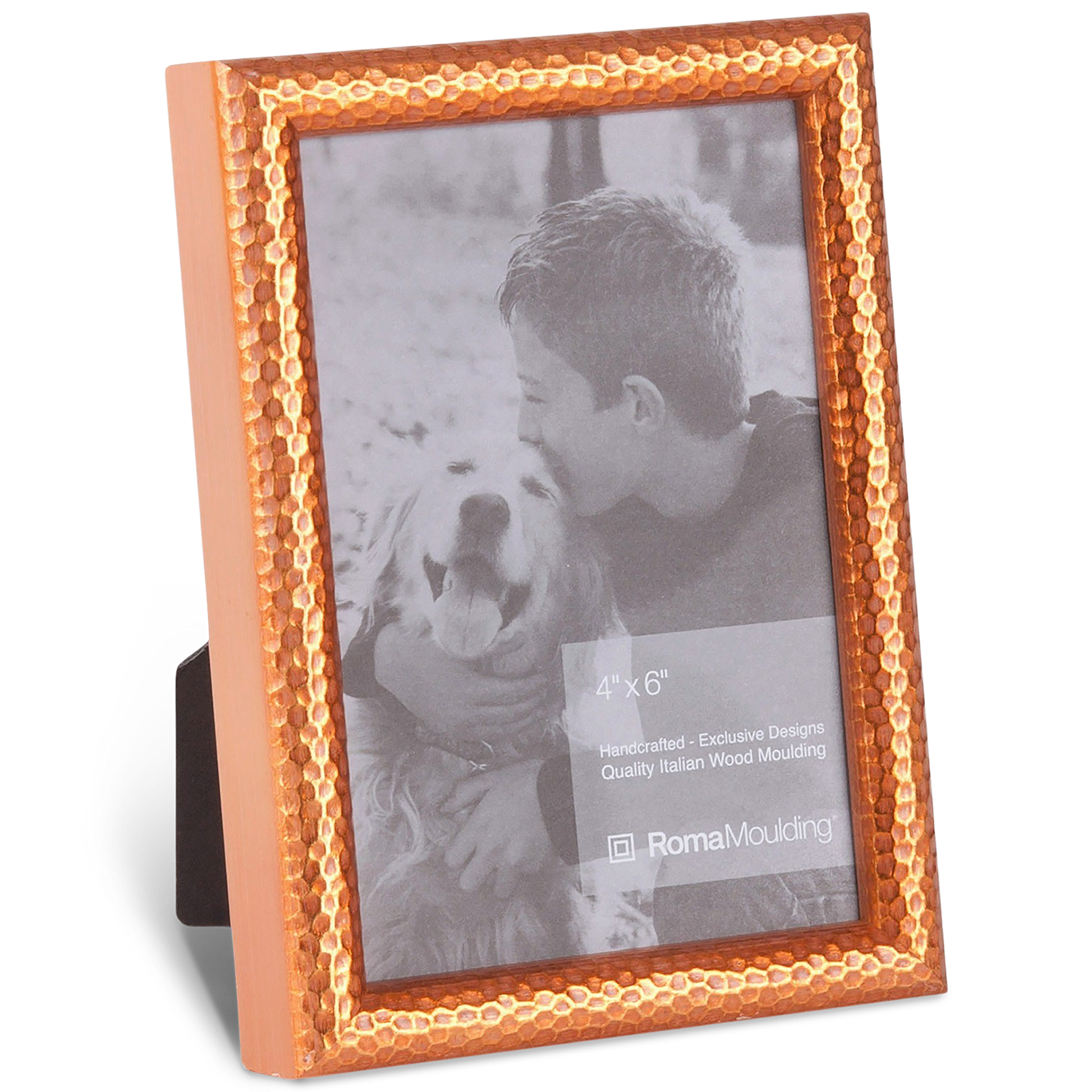 A textured copper frame encases a black-and-white photo of a smiling boy hugging a panting dog. The scene exudes warmth and affection.