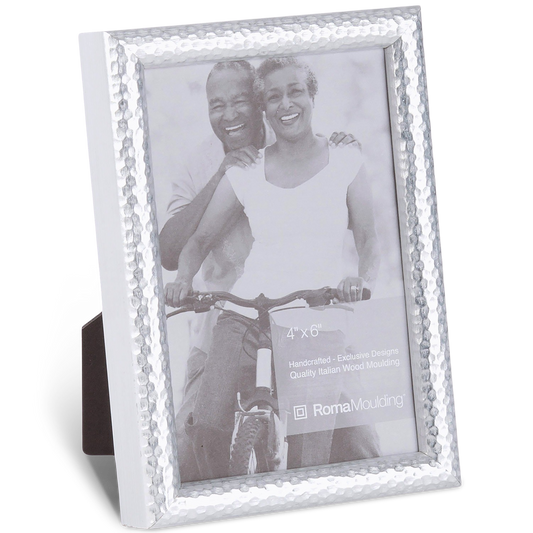 Silver picture frame with hammered texture holds a black-and-white photo of a smiling couple on a bicycle. Frame size is 4x6 inches.