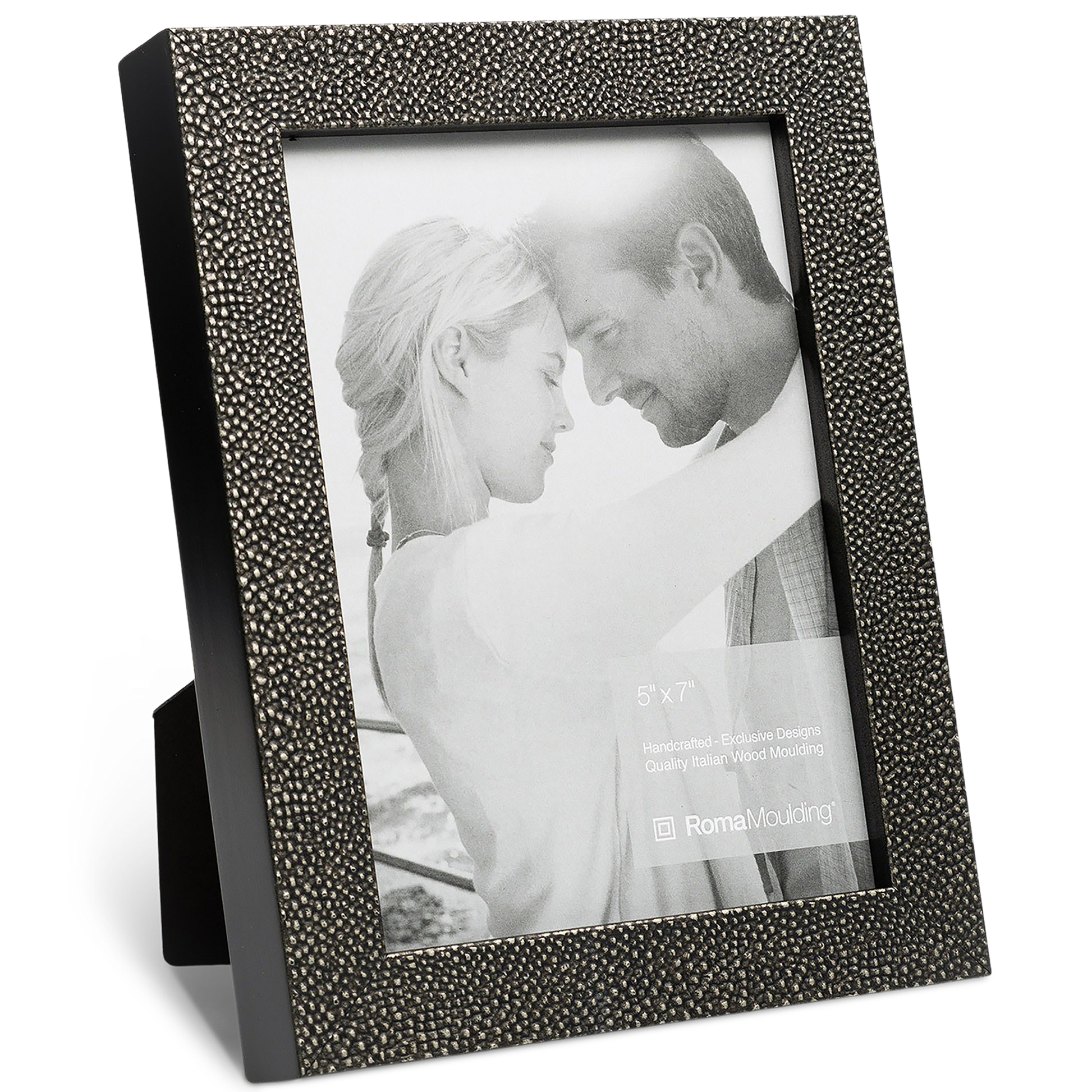 A textured dark grey picture frame holds a black-and-white photo of a couple gently embracing, conveying warmth and affection. The frame stands upright.