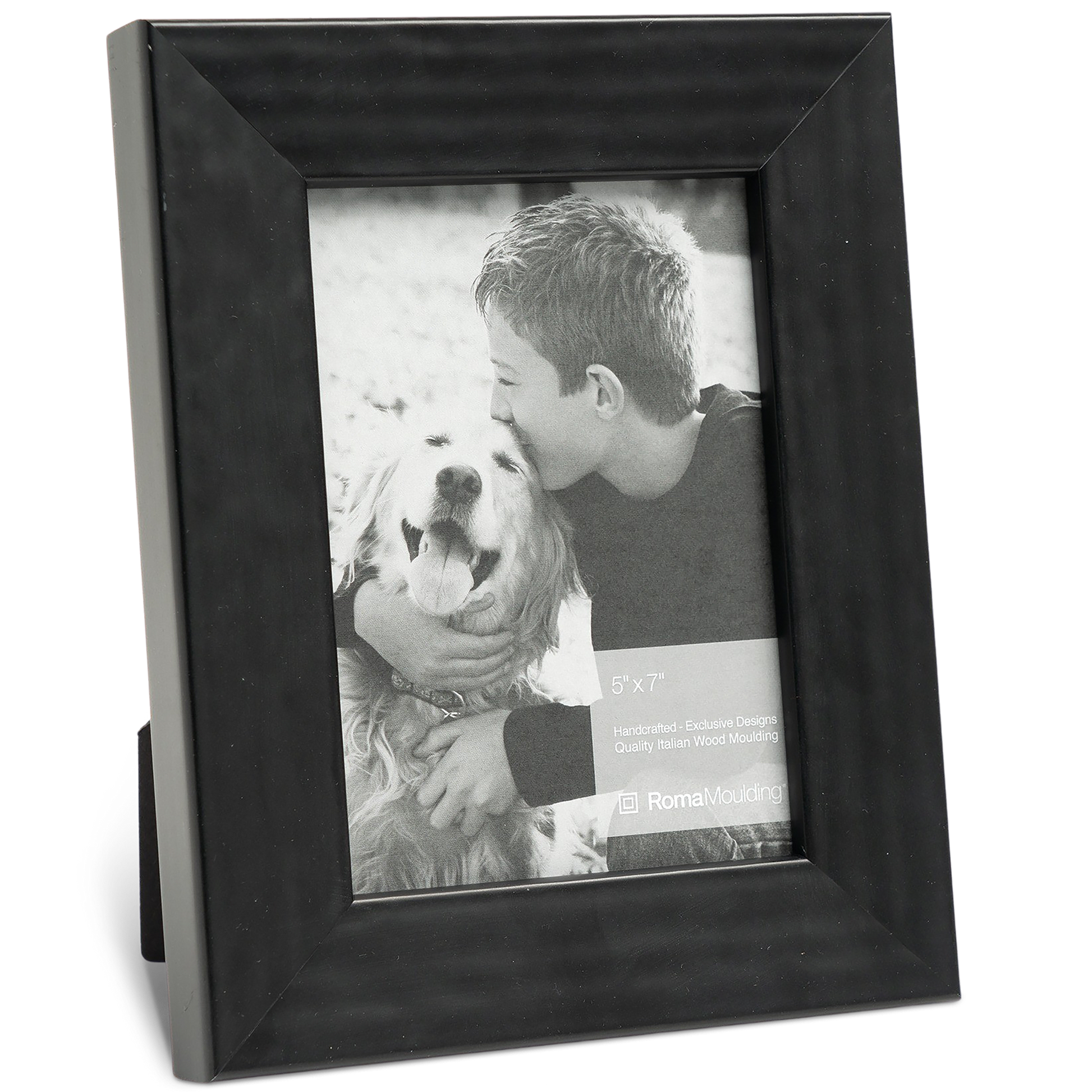 A black frame holds a black-and-white photo of a young boy affectionately hugging a smiling golden retriever. The scene conveys warmth and friendship.