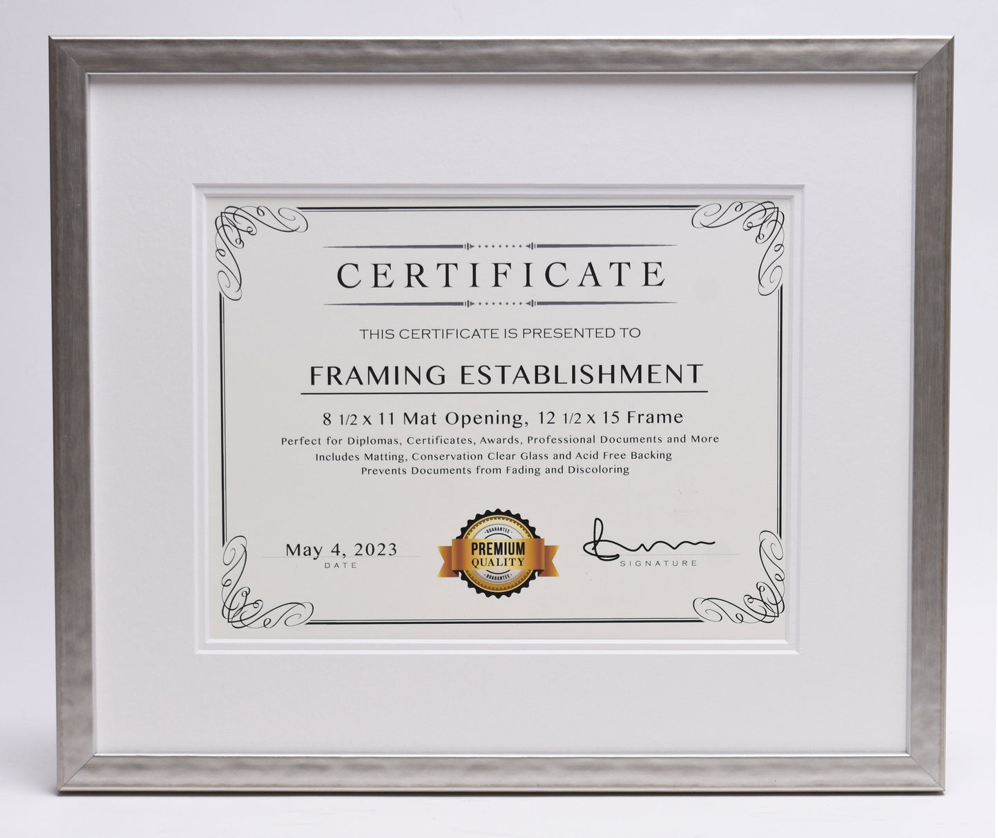 Framed certificate for a framing establishment, dated May 4, 2023. Features decorative borders, premium quality seal, and signature lines.