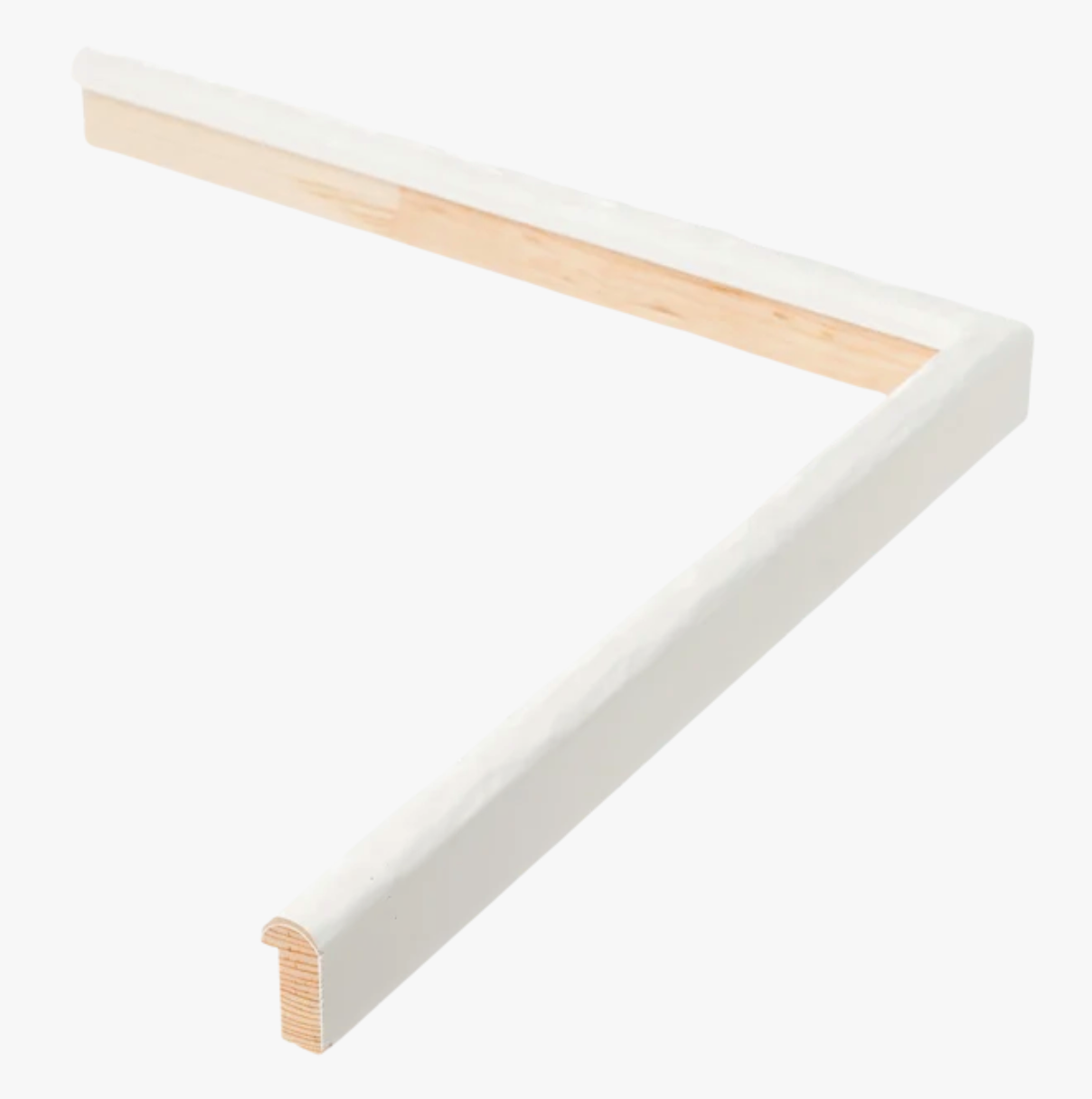 A white and light wood L-shaped corner shelf, featuring a smooth finish, lies against a plain white background. It conveys a sense of simplicity and modern design.