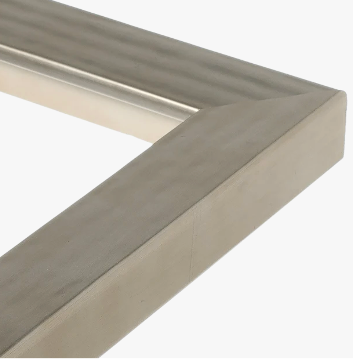 Close-up of a sleek wooden frame corner, featuring a smooth, light gray surface with subtle texture. The frame exudes a modern, minimalist feel.