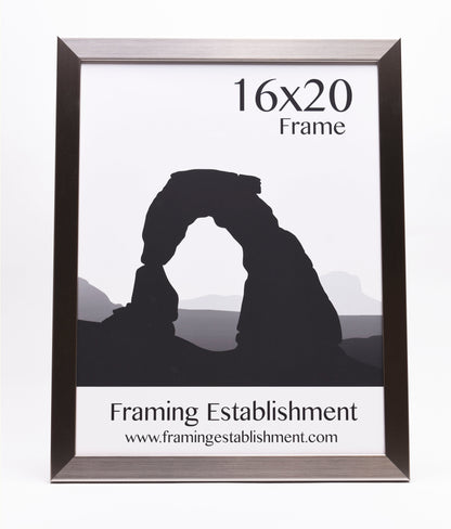 A 16x20 frame displays a black silhouette of a rock arch against a pale background. Text below reads "Framing Establishment" and a website URL.