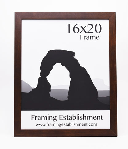 A wooden frame surrounds an image of a silhouette of a rock arch. Text reads "16x20 Frame" and "Framing Establishment" with a website link.