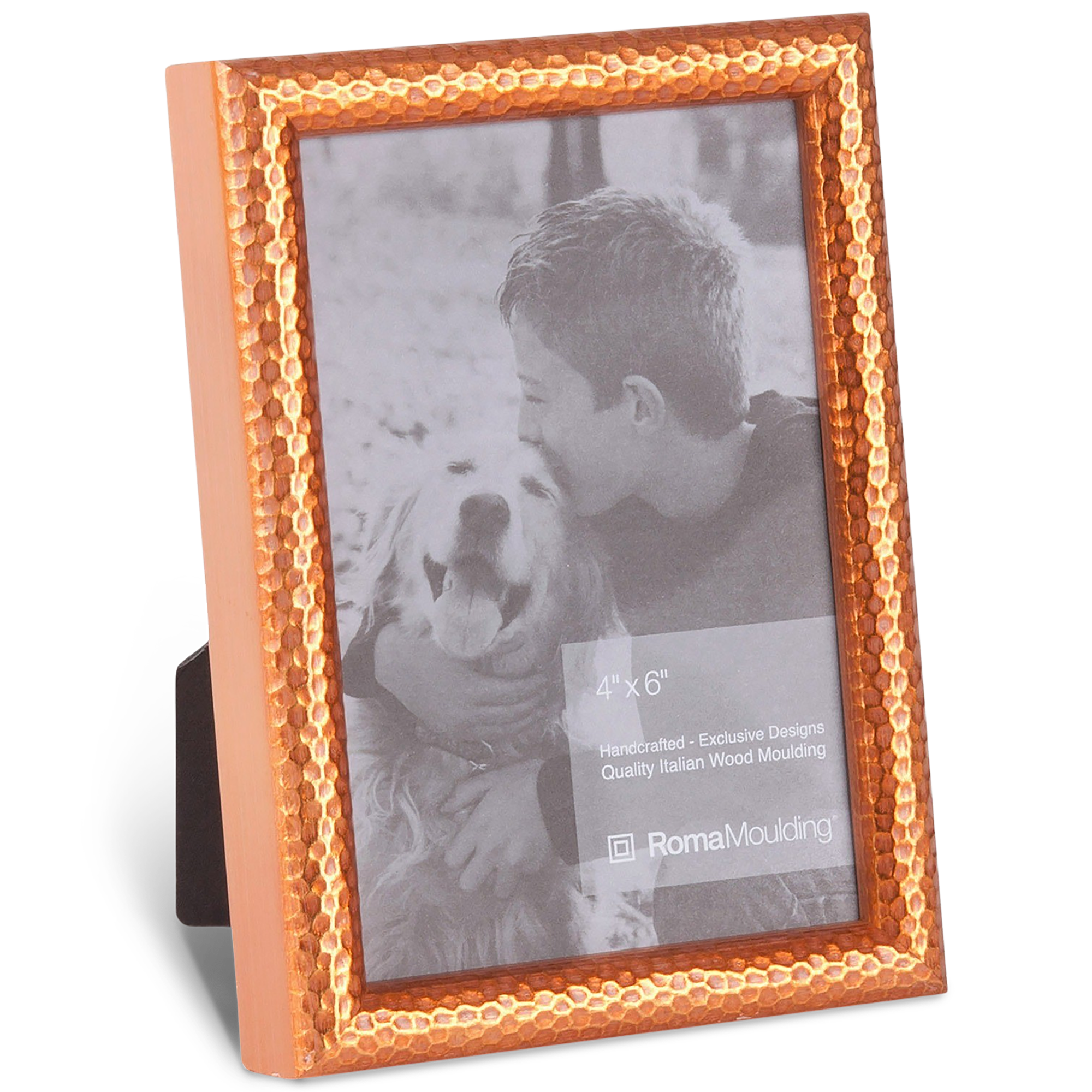 A textured copper frame encases a black-and-white photo of a smiling boy hugging a panting dog. The scene exudes warmth and affection.