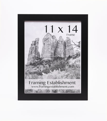 Black frame displaying a black-and-white photo of towering rock formations, labeled "11 x 14 Frame" with "Framing Establishment" and website below.
