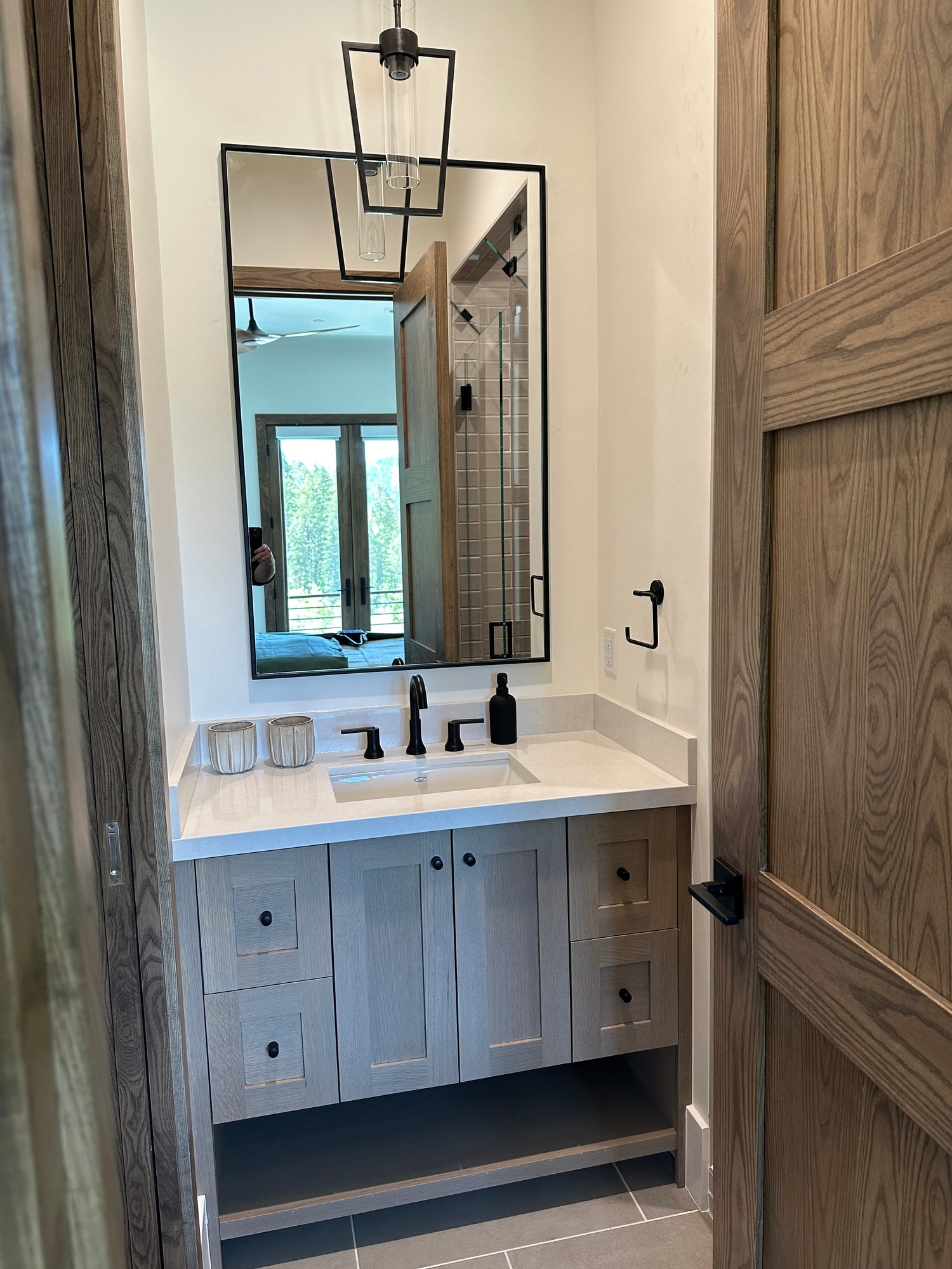 Modern interior with wooden ceiling, mirror, and cabinets.