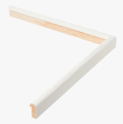A white and light wood L-shaped corner shelf, featuring a smooth finish, lies against a plain white background. It conveys a sense of simplicity and modern design.