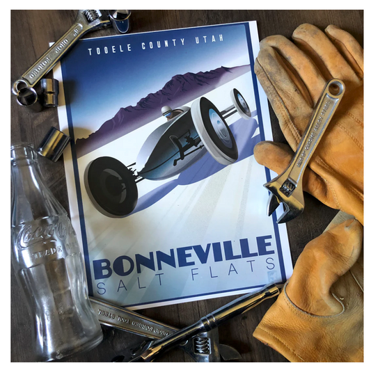 Poster of a vintage race car at Bonneville Salt Flats, with tools, work gloves, and a Coke bottle around it, evoking a nostalgic and adventurous mood.