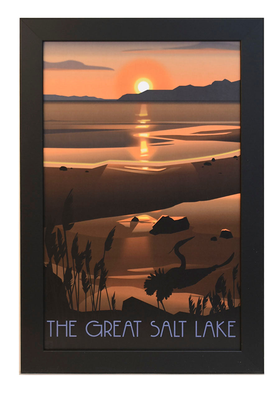 Framed poster of The Great Salt Lake at sunset. Silhouetted landscape features distant mountains, calm water, and reeds, creating a serene atmosphere.